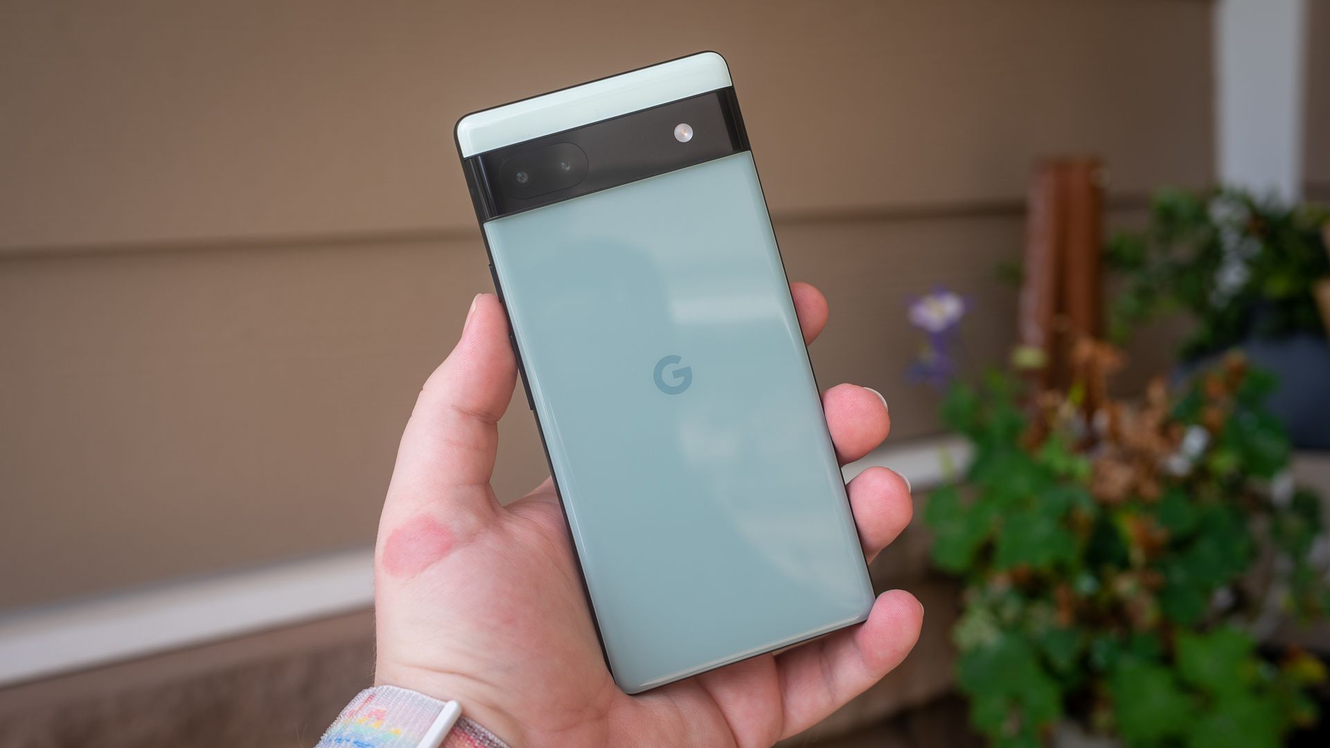 Google Pixel 6a held in a person's hand