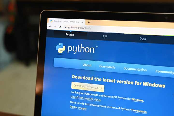 A laptop with the Python download webpage open on Chrome.