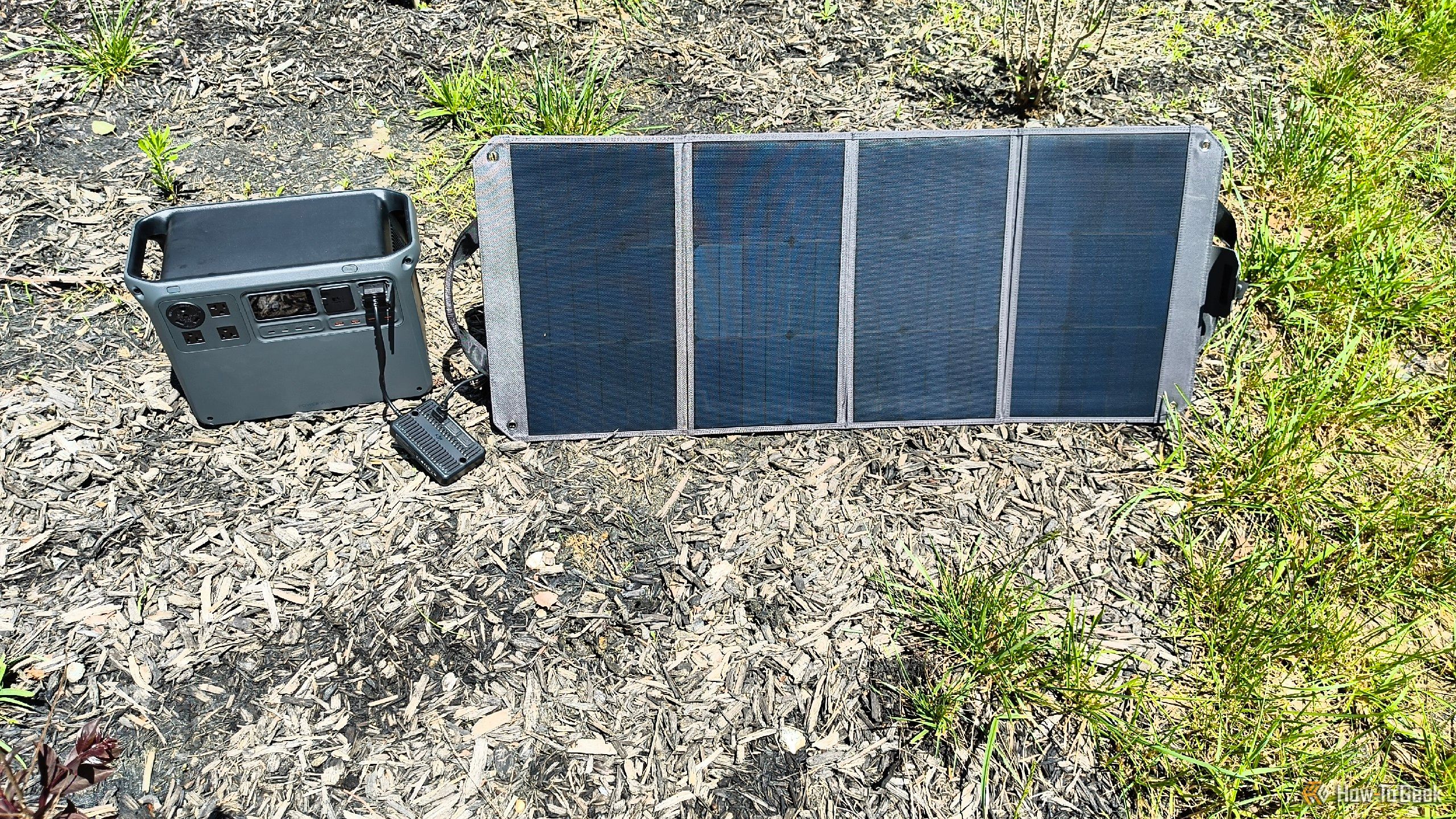 A DJI Power 2000 charging via a 100W portable solar panel.