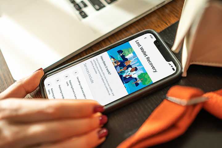 A person using ATT wallet recovery on their phone
