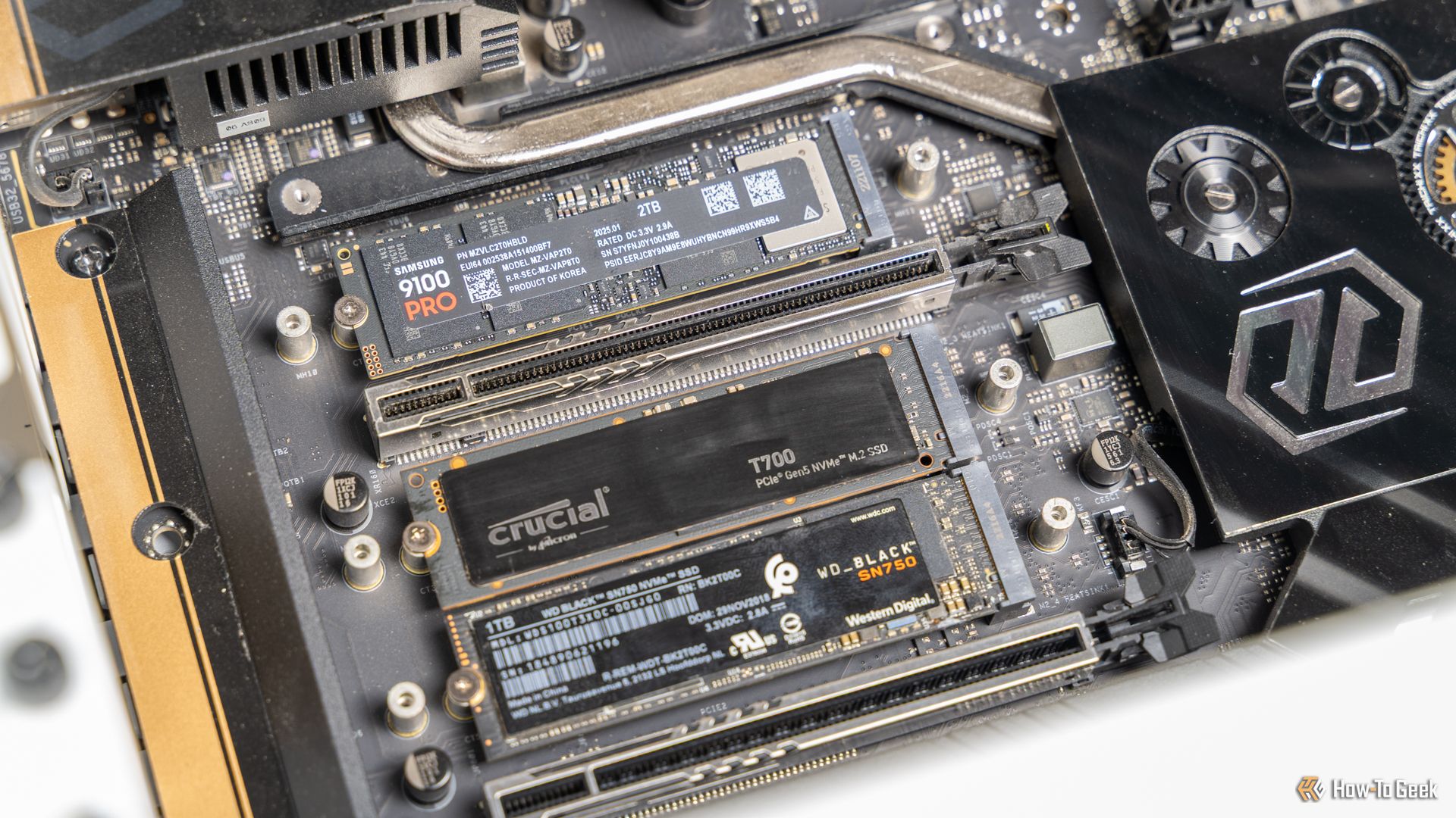 The Samsung 9100 PRO NVMe SSD installed in a motherboard with other M.2 drives.