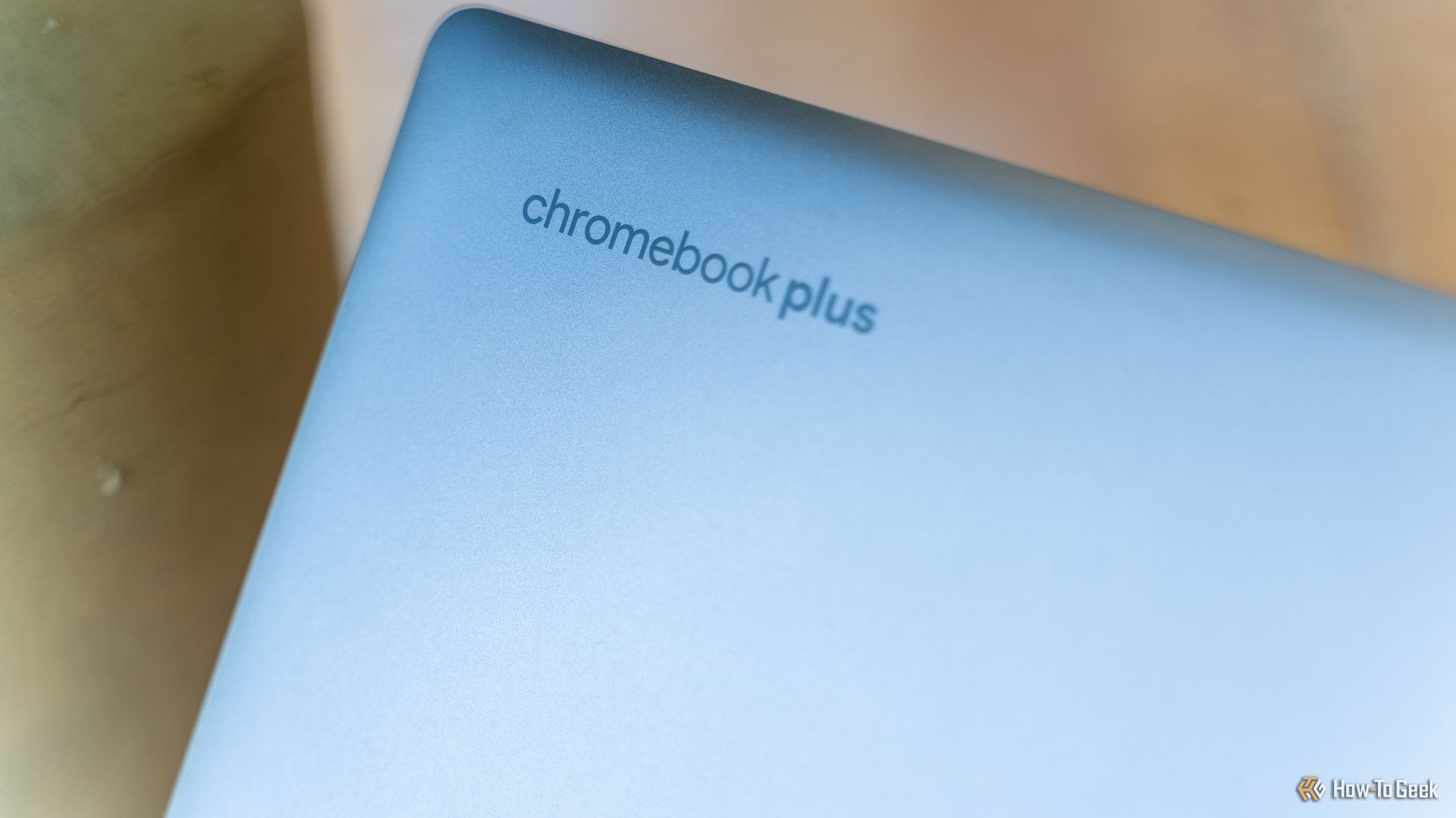 The Chromebook Plus logo on the lid of the HP Chromebook Plus x360 14b.