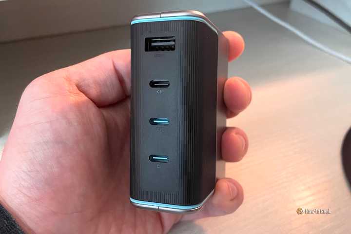 A person holding the CUKTECH 15 GaN 140W Charger.