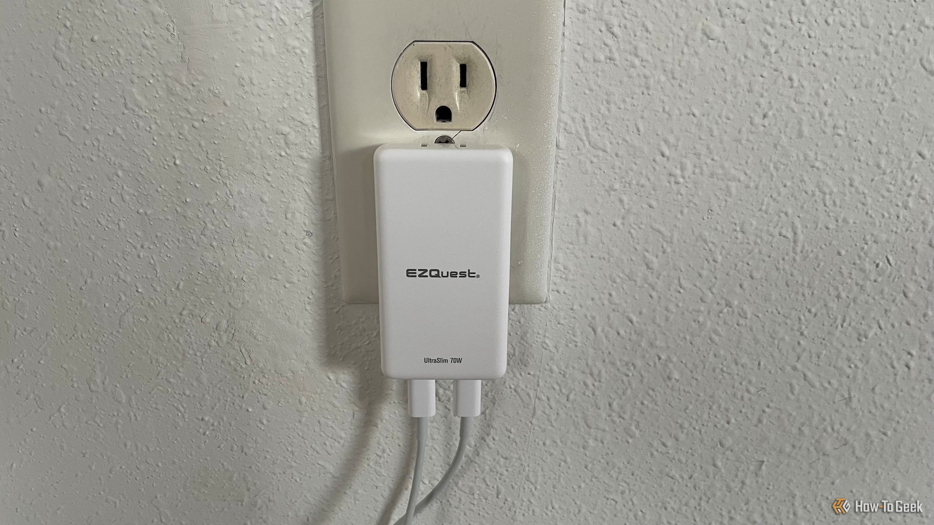 The EZQuest UltraSlim 70W Wall Charger plugged into an AC outlet.