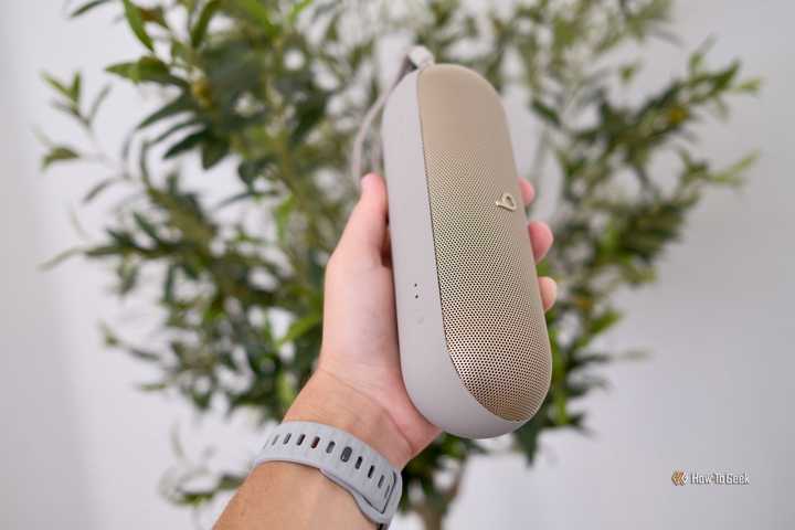hand holding Beats Pill
