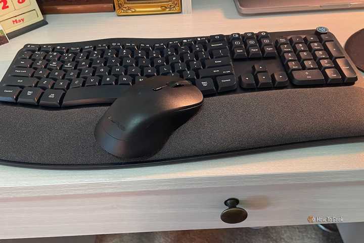 The JLab Mouse and Keyboard Bundle sitting on a desk.