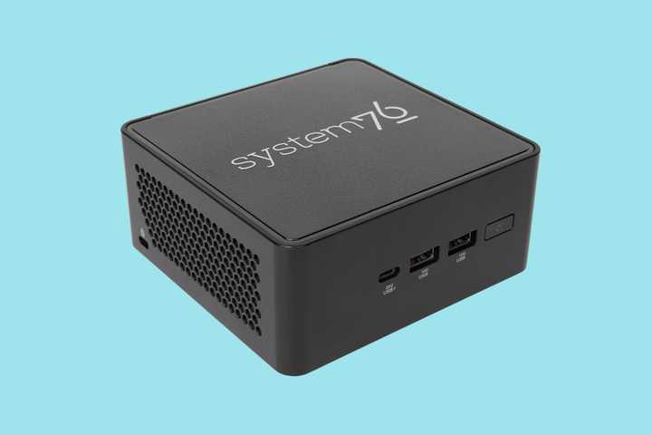 The refreshed System76 Meerkat mini PC on a blue background.