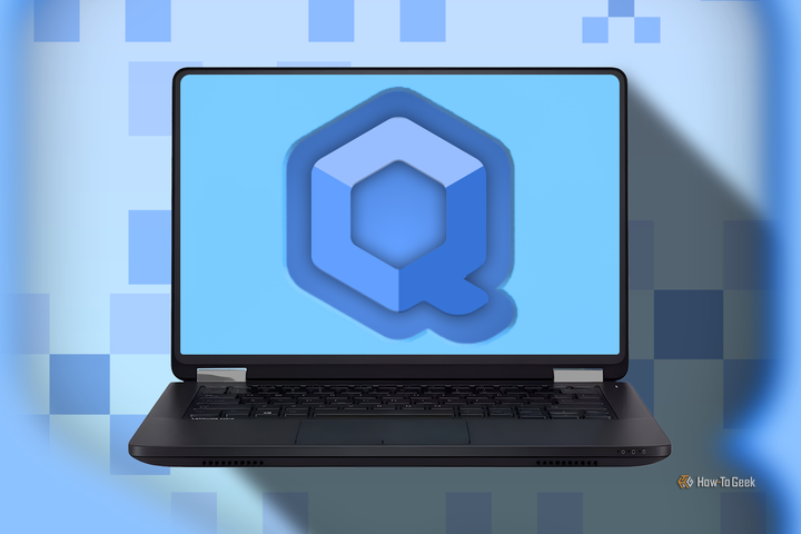 A laptop displaying the Qubes OS logo, with a background of abstract cube patterns in shades of blue.